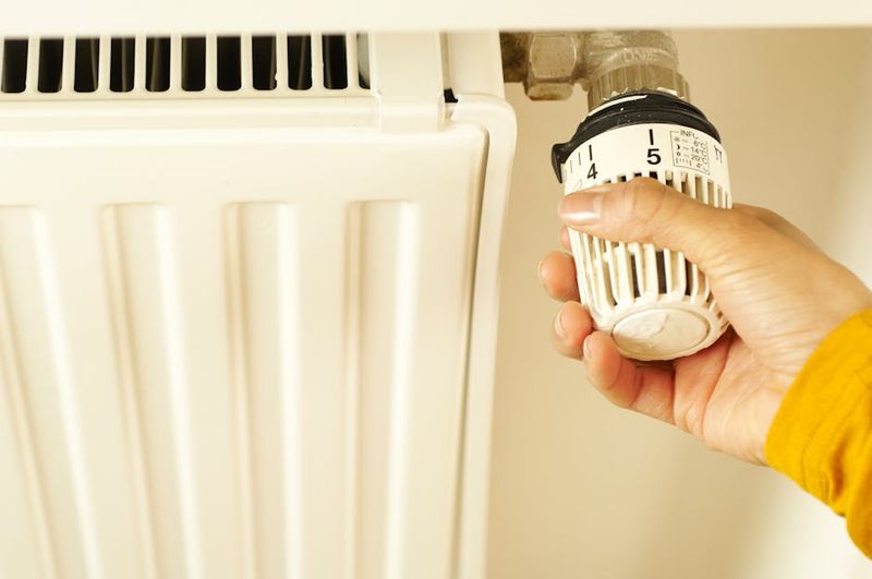 Home thermostat showing energy efficient temperature