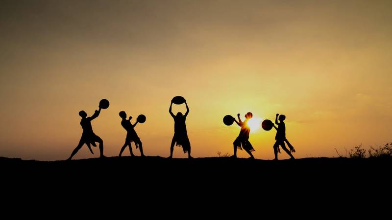 Festival performers at sunset