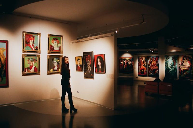 Visitor admiring art in a gallery